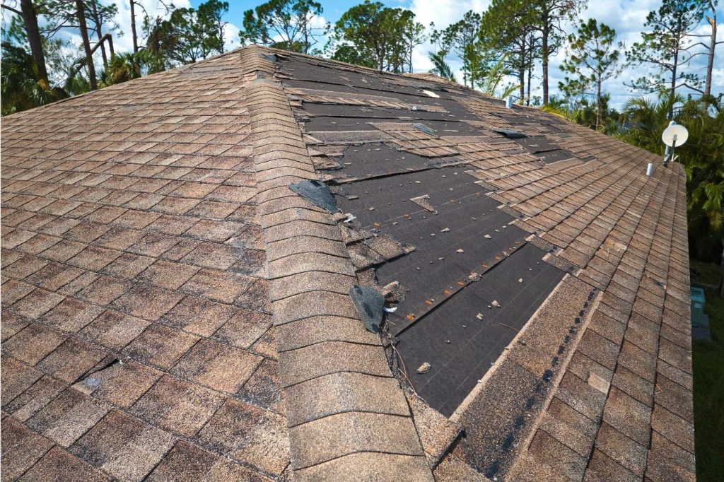 damaged-house-roof-with-missing-shingles-after-hurricane