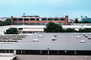 high angle view-buildings city against sky my-roof-guys